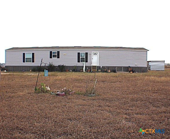 12240 Fm 1383 Schulenburg, TX 78956 - Photo 1 of 24 a backyard of a house