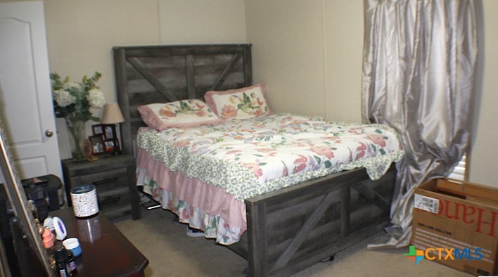 12240 Fm 1383 Schulenburg, TX 78956 - Photo 11 of 24 a bedroom with a bed and a window
