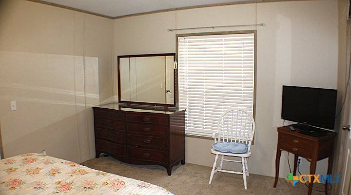 12240 Fm 1383 Schulenburg, TX 78956 - Photo 7 of 24 a bedroom with a bed and a television