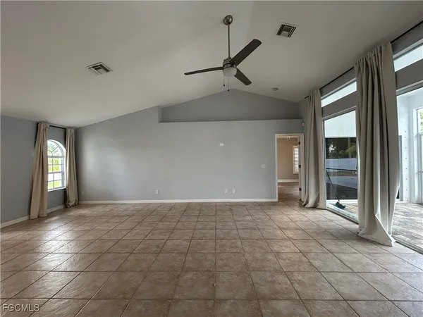 a view of an empty room and window in a room