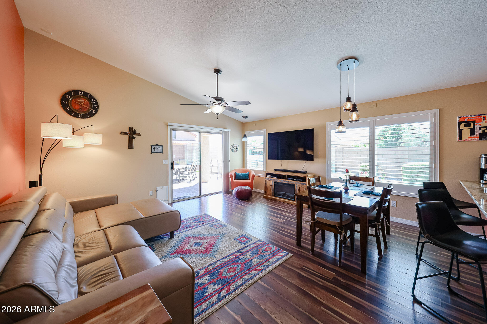 6939 West Phelps Road Peoria, AZ 85382 - Photo 11 of 29 a living room with furniture and a flat screen tv