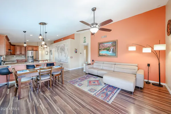 a living room with lots of furniture and a chandelier