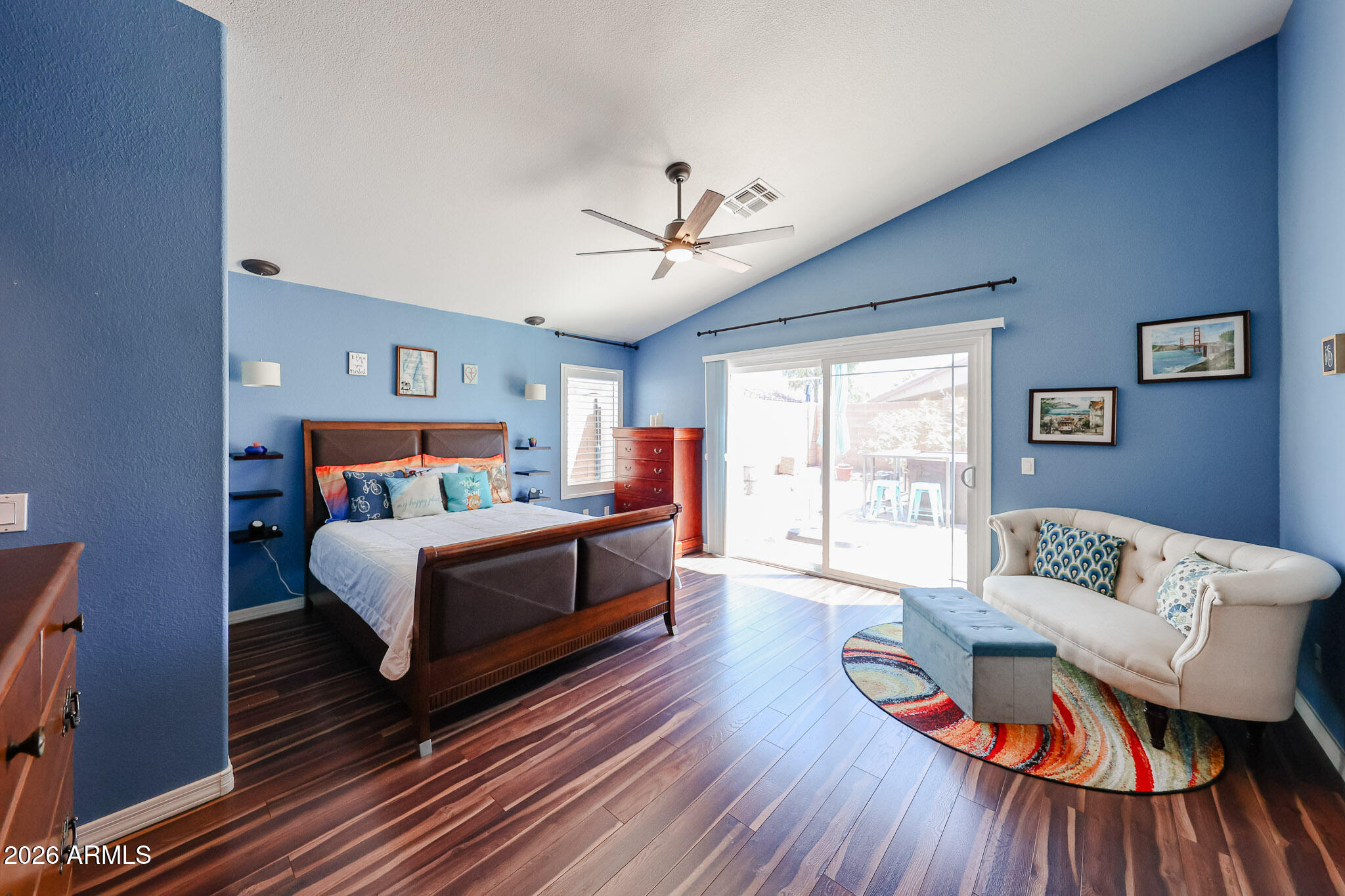 6939 West Phelps Road Peoria, AZ 85382 - Photo 13 of 29 a bedroom with furniture and wooden floor