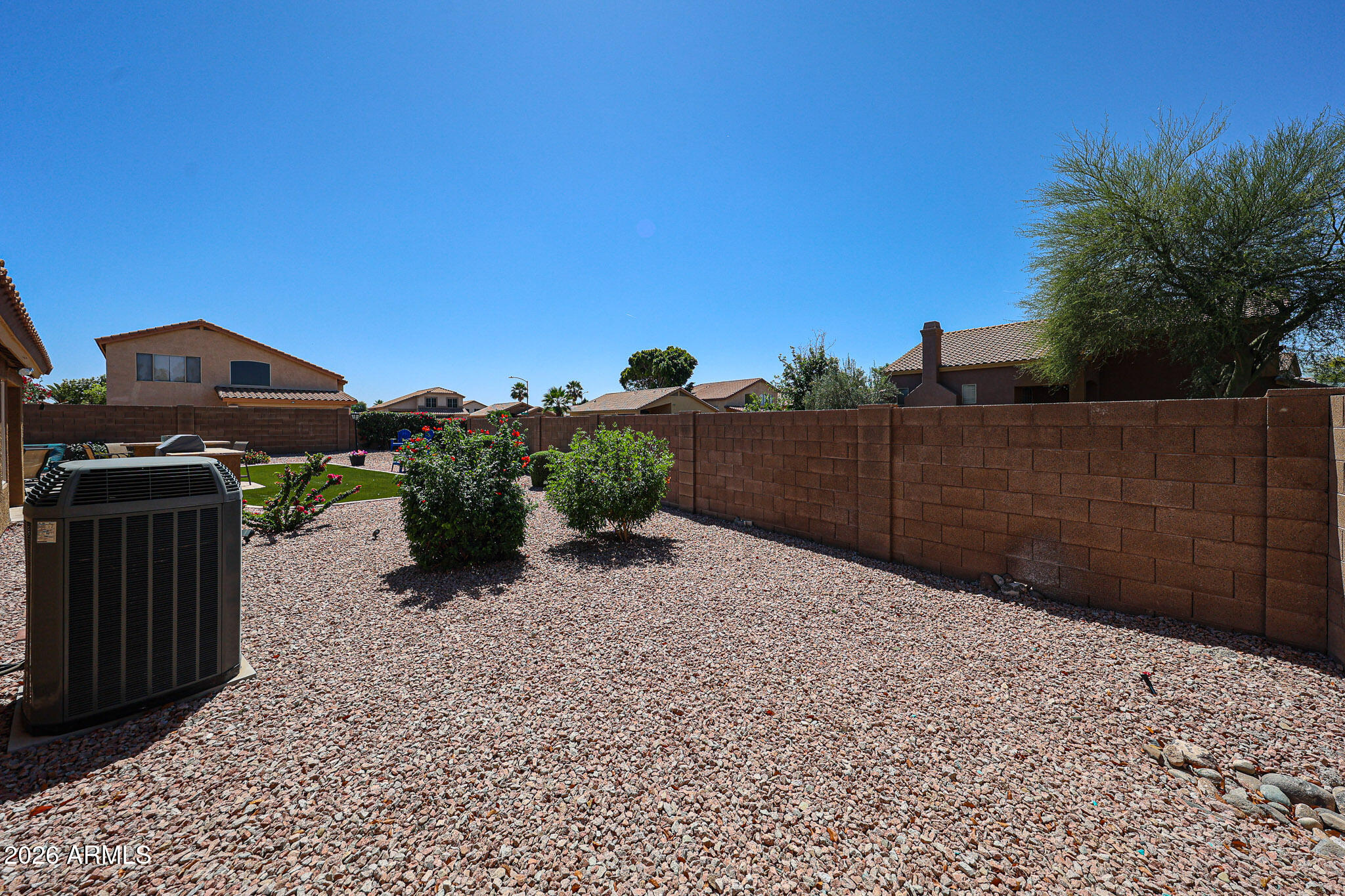6939 West Phelps Road Peoria, AZ 85382 - Photo 23 of 29 a view of a backyard of the house
