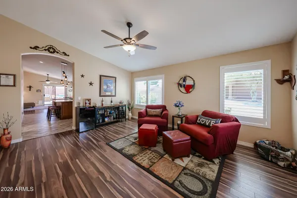 a living room with furniture or couch and a wooden floor