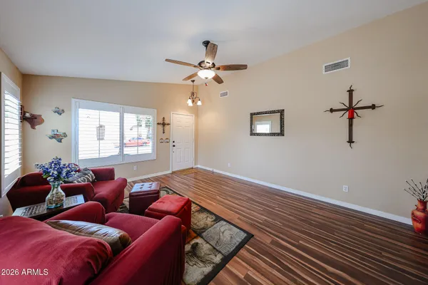 a bedroom with furniture and a window