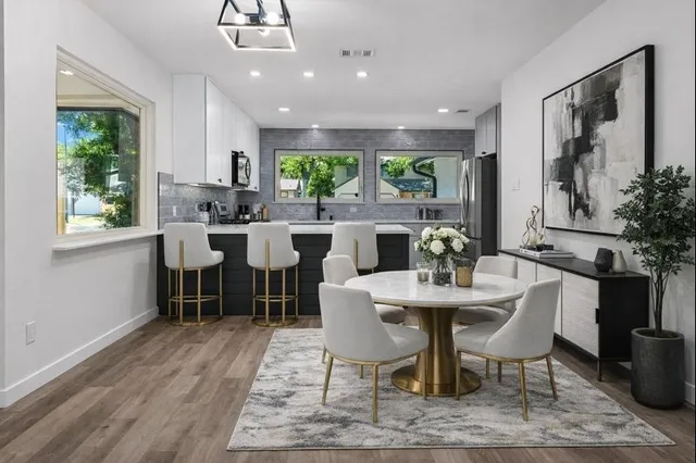 a view of a dining room with furniture window and outside view