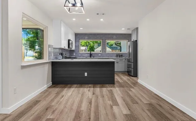 a room with a window and mirror