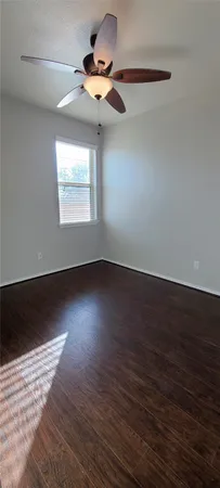 a view of room window and wooden floor