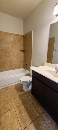 a bathroom with a sink a toilet and bathtub