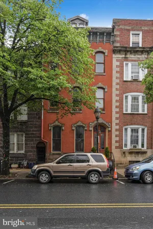 a view of a car parked in front of a buildings