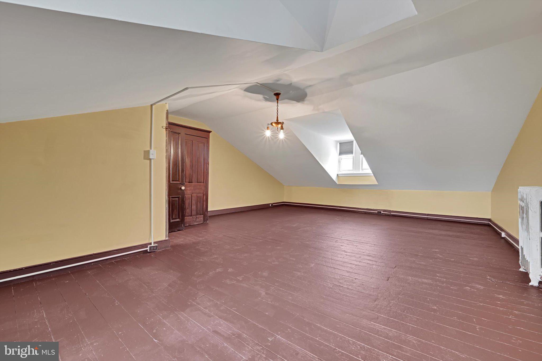 226 South 5th Street Reading, PA 19602 - Photo 22 of 47 an empty room with wooden floor and windows