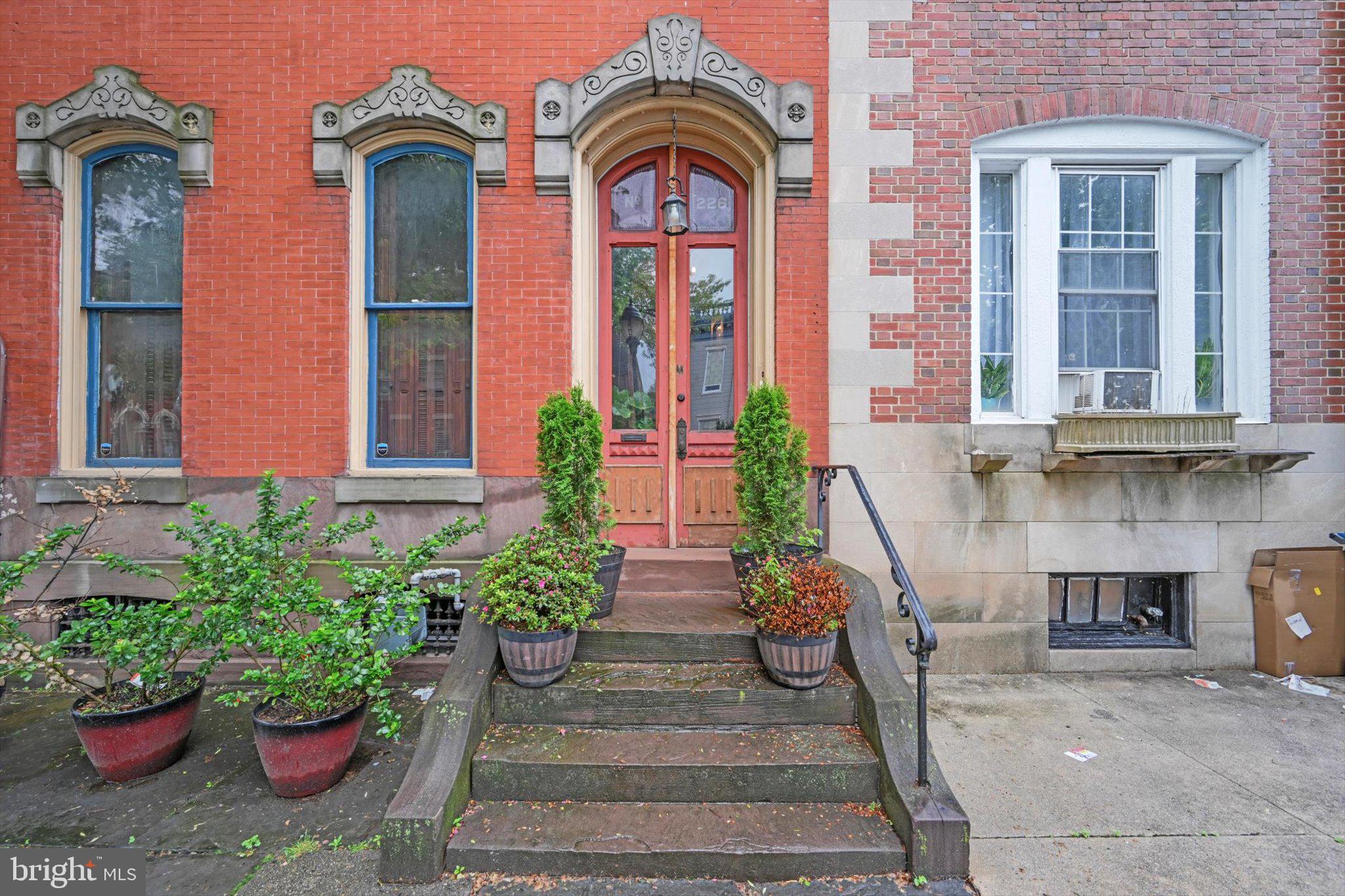 226 South 5th Street Reading, PA 19602 - Photo 5 of 47 a front view of a house with a garden