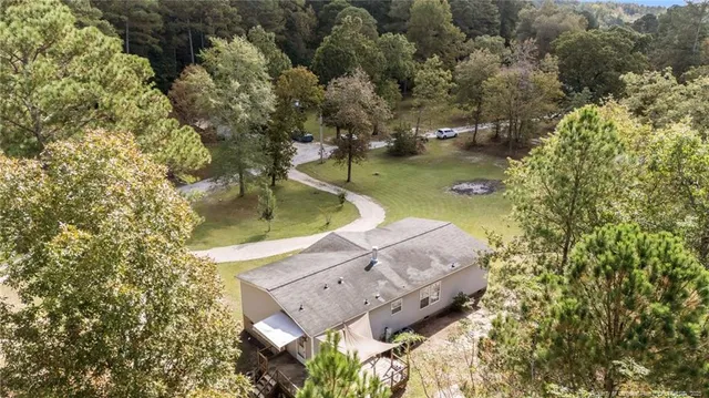 a view of a wooden deck and lake view