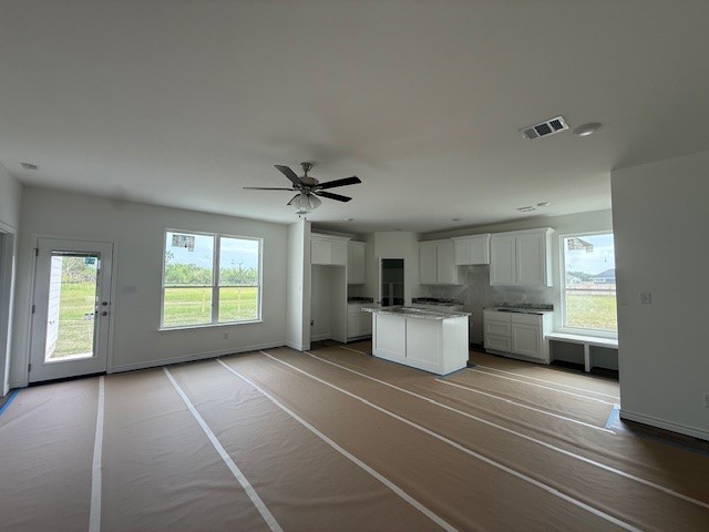 2607 Falcon Ridge Drive Bryan, TX 77803 - Photo 6 of 8 a large room with a couch and a window