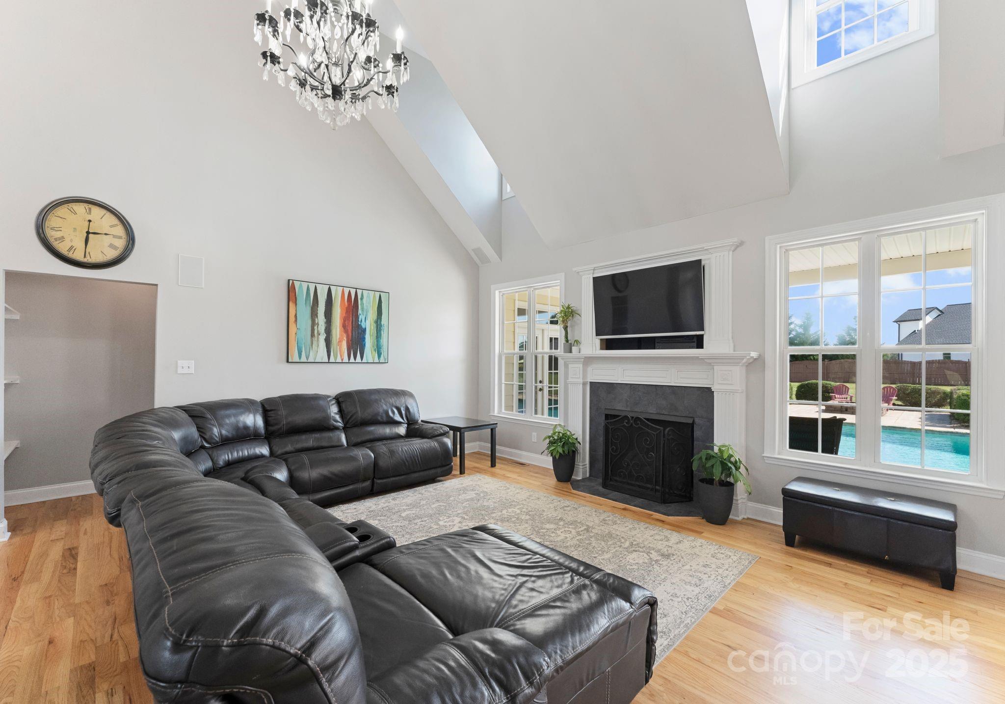 895 East Monbo Road Statesville, NC 28677 - Photo 14 of 44 a living room with furniture fireplace and flat screen tv
