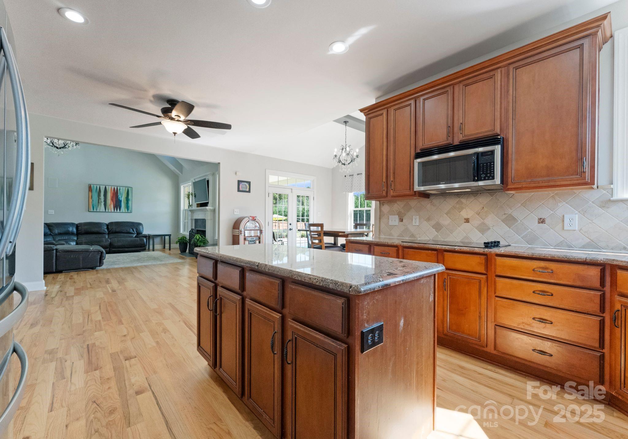 895 East Monbo Road Statesville, NC 28677 - Photo 20 of 44 a kitchen with stainless steel appliances granite countertop a sink stove and microwave