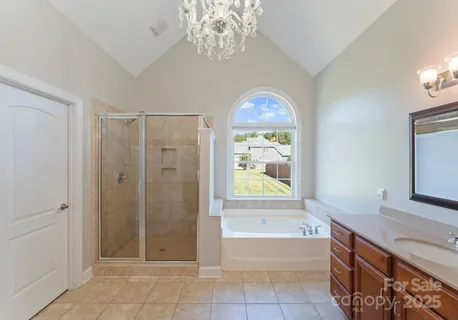 a bathroom with bathtub a shower and a sink