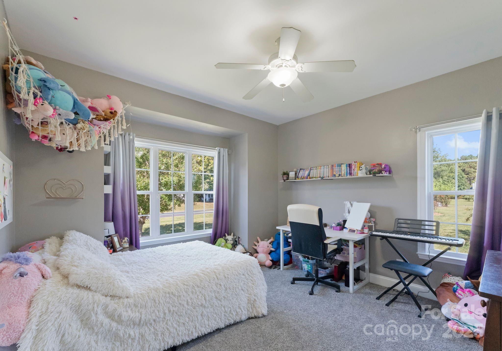 895 East Monbo Road Statesville, NC 28677 - Photo 26 of 44 a bedroom with a bed and a desk