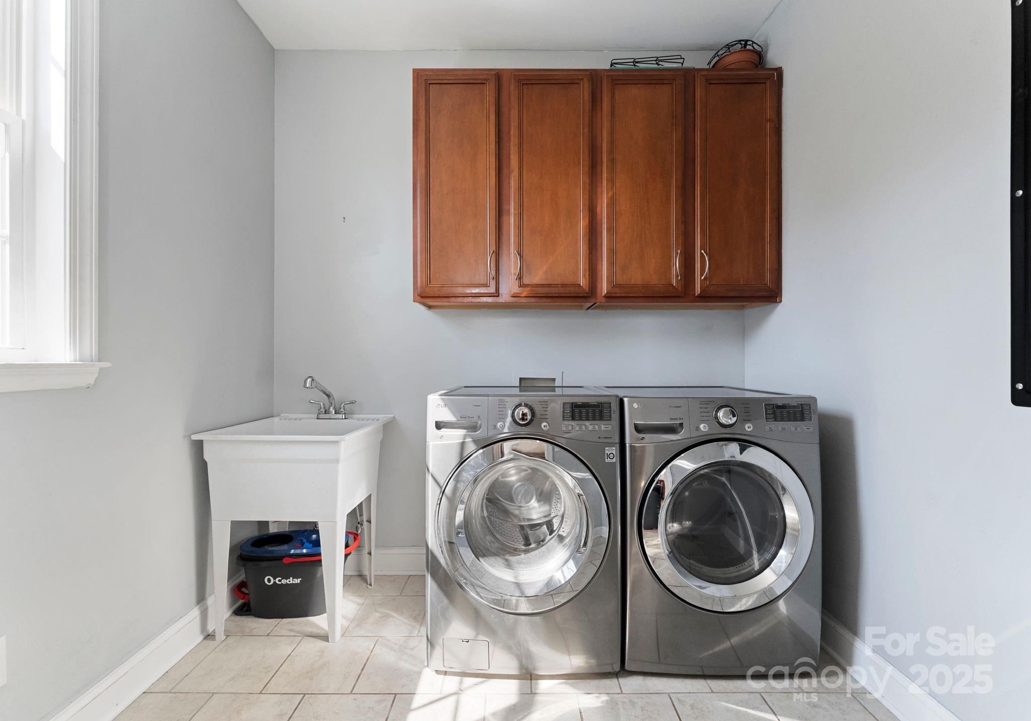 895 East Monbo Road Statesville, NC 28677 - Photo 32 of 44 a view of a storage and utility room with washer and dryer