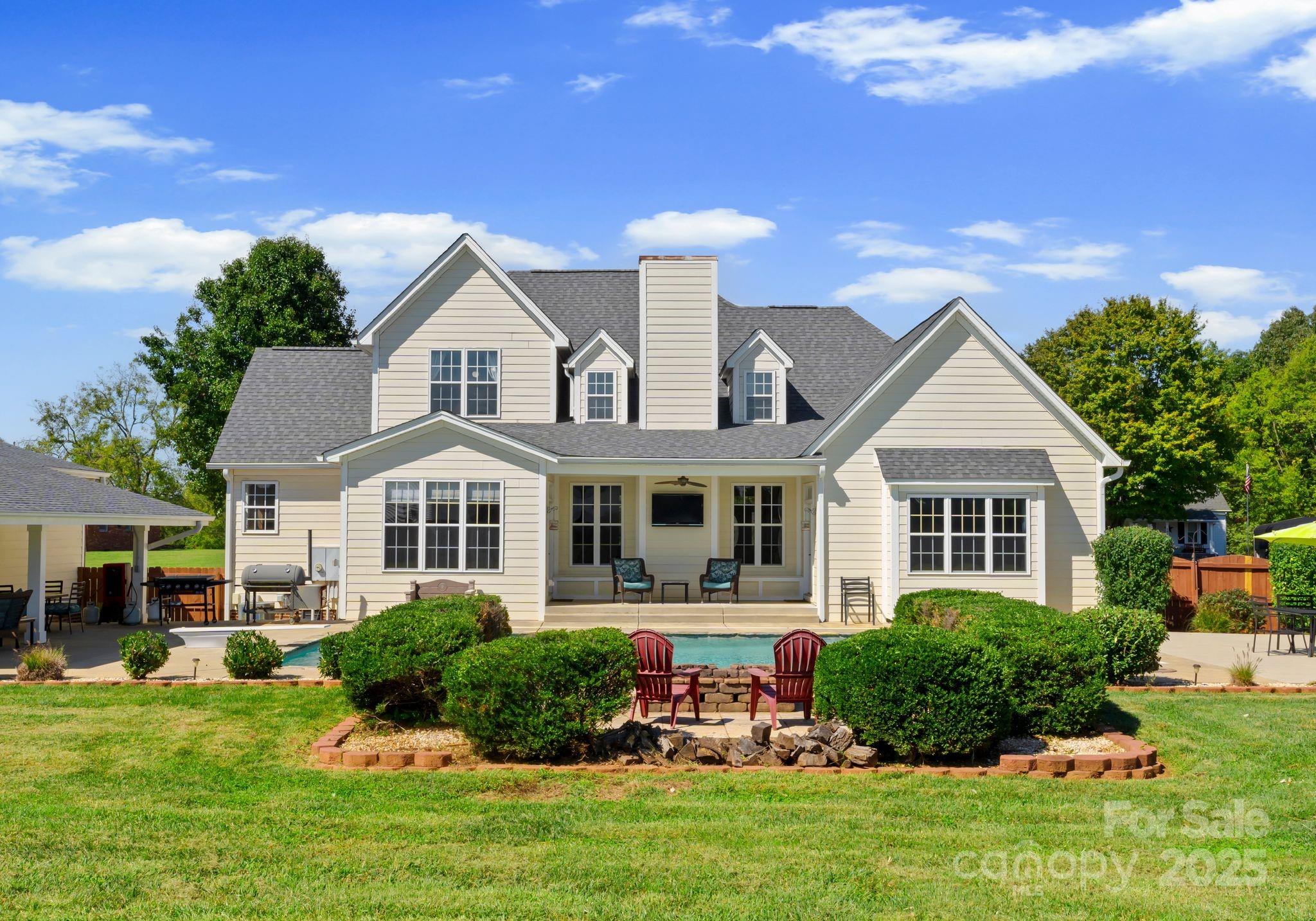 895 East Monbo Road Statesville, NC 28677 - Photo 40 of 44 a front view of a house with a yard and trees