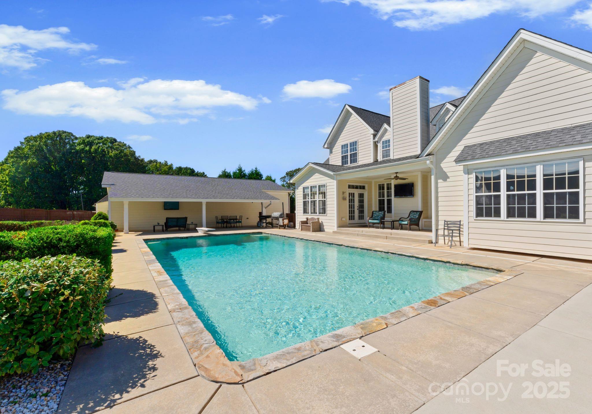 895 East Monbo Road Statesville, NC 28677 - Photo 42 of 44 a front view of a house with a yard