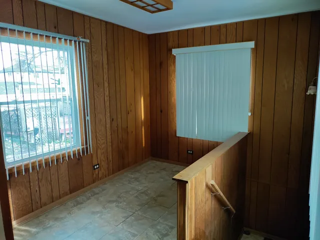 a view of a backyard with potted plants