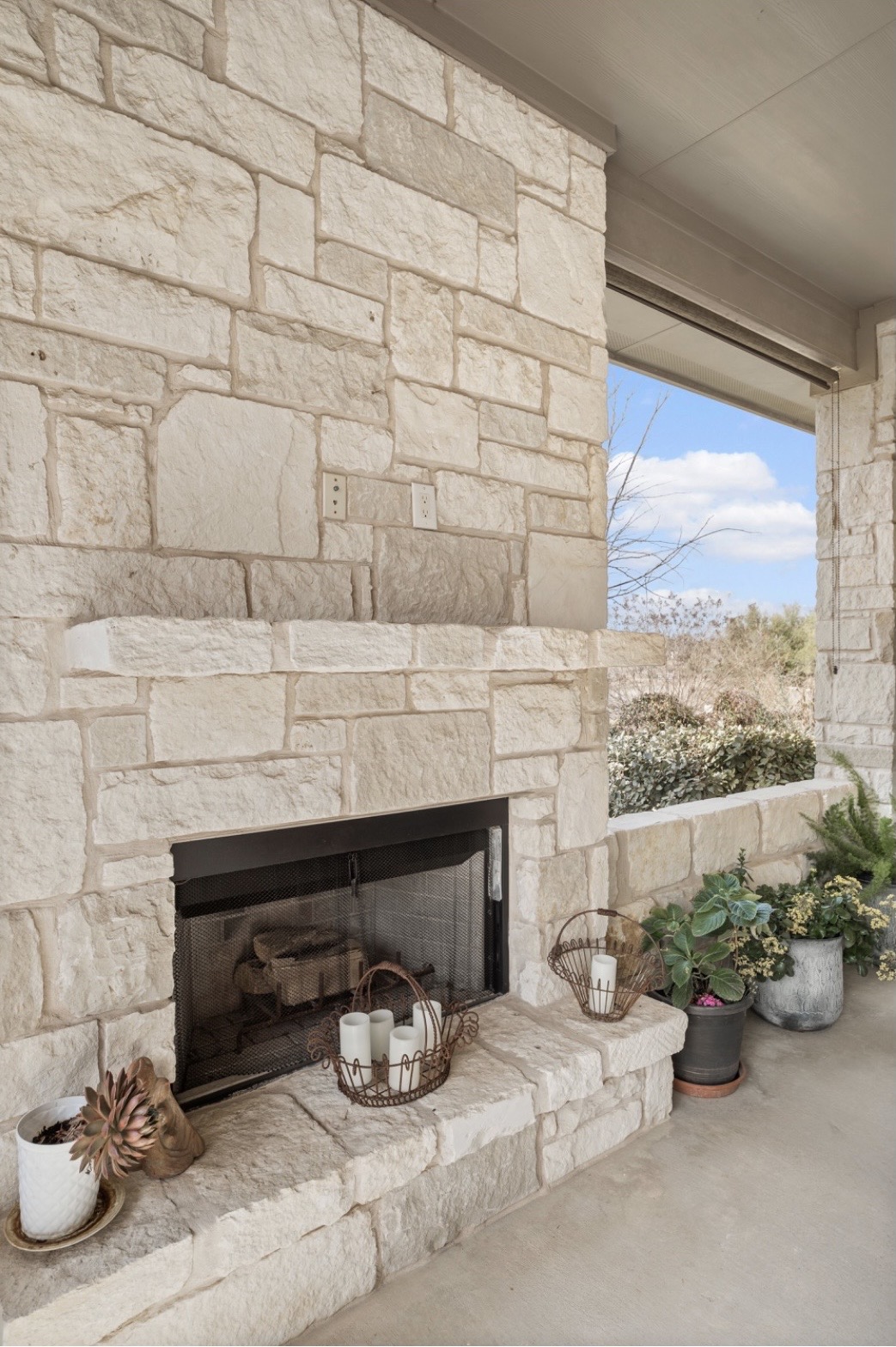 201 Greenridge Lane Dripping Springs, TX 78620 - Photo 26 of 29 Wrap around porch with stone fireplace