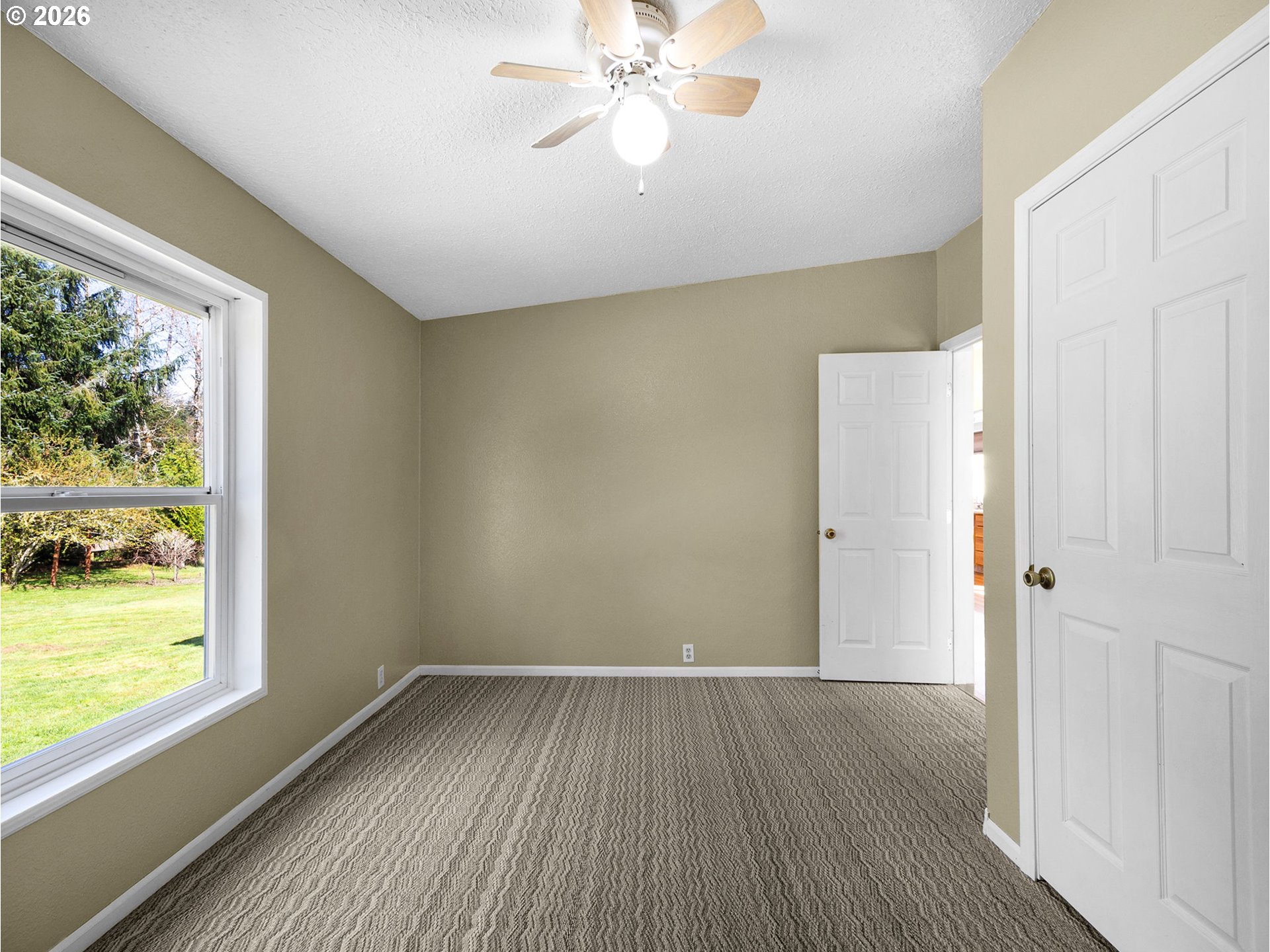 44176 Highway 30 Astoria, OR 97103 - Photo 13 of 32 a view of an empty room with wooden floor and a window