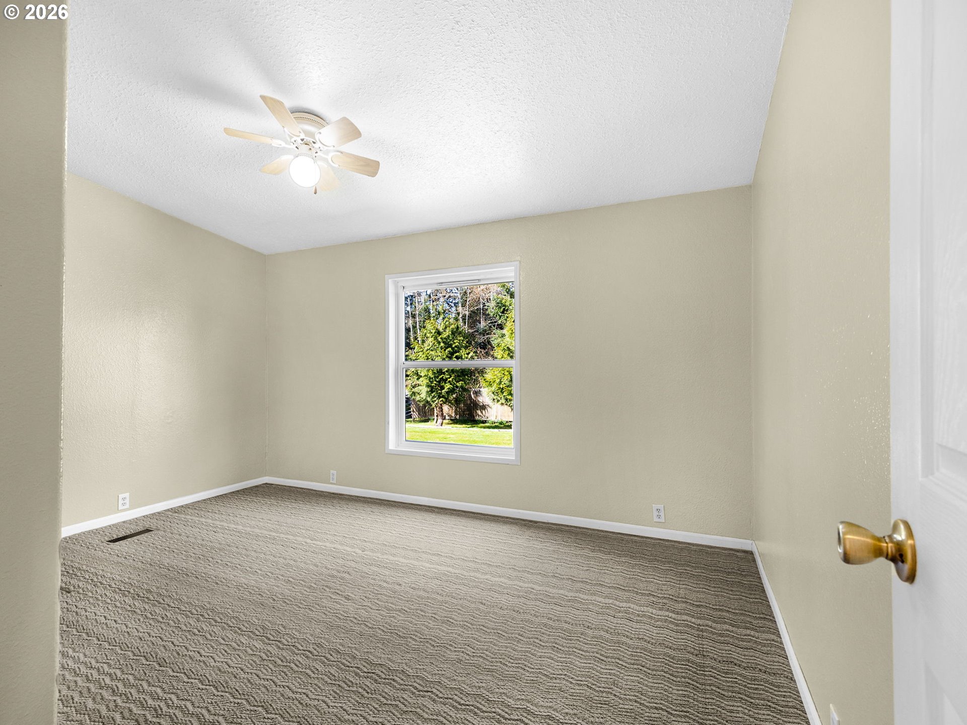 44176 Highway 30 Astoria, OR 97103 - Photo 15 of 32 an empty room with wooden floor and windows