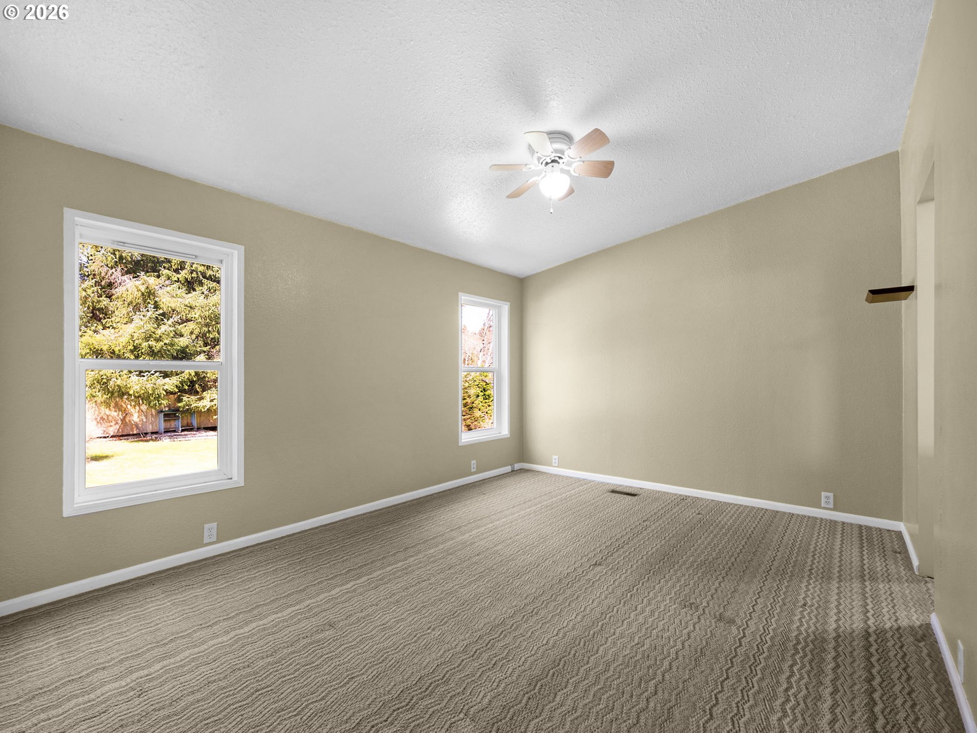 44176 Highway 30 Astoria, OR 97103 - Photo 17 of 32 a view of an empty room with window and wooden floor