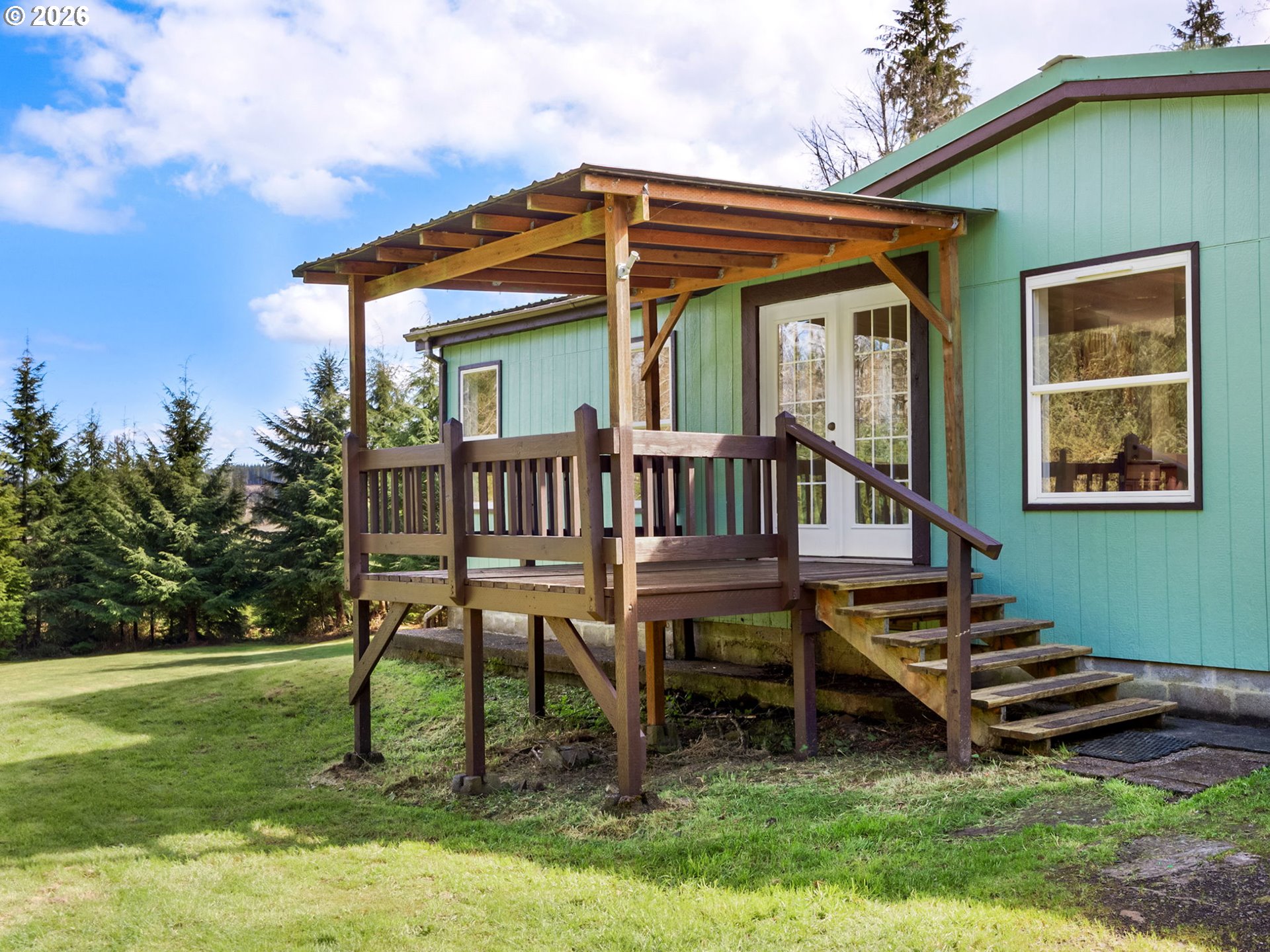 44176 Highway 30 Astoria, OR 97103 - Photo 2 of 32 a view of a house with a yard porch and sitting area