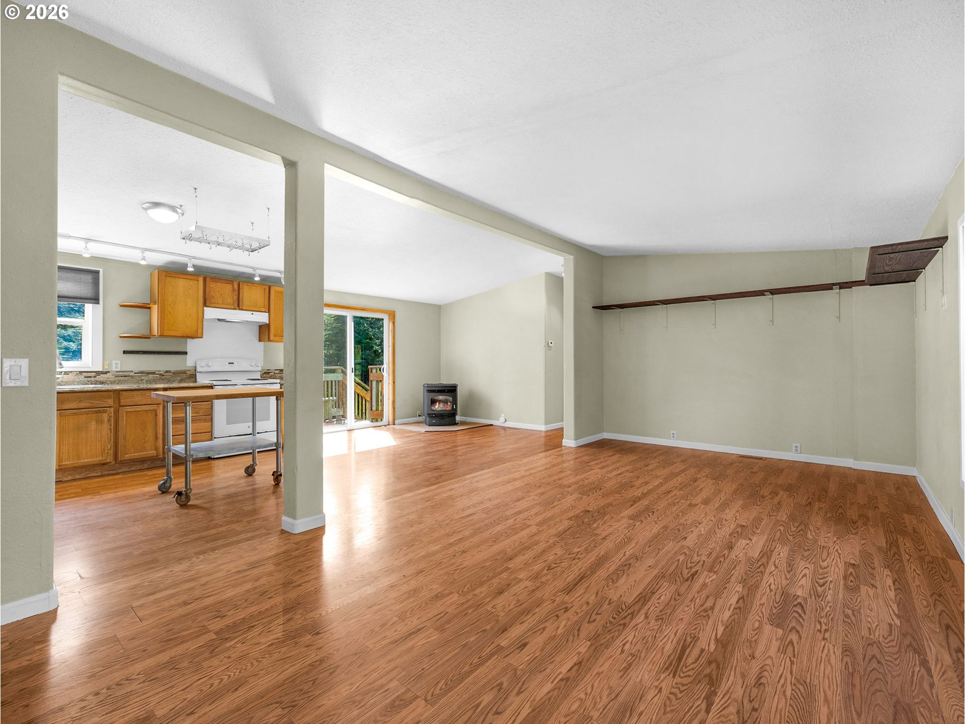 44176 Highway 30 Astoria, OR 97103 - Photo 4 of 32 a view of an empty room with wooden floor and a window