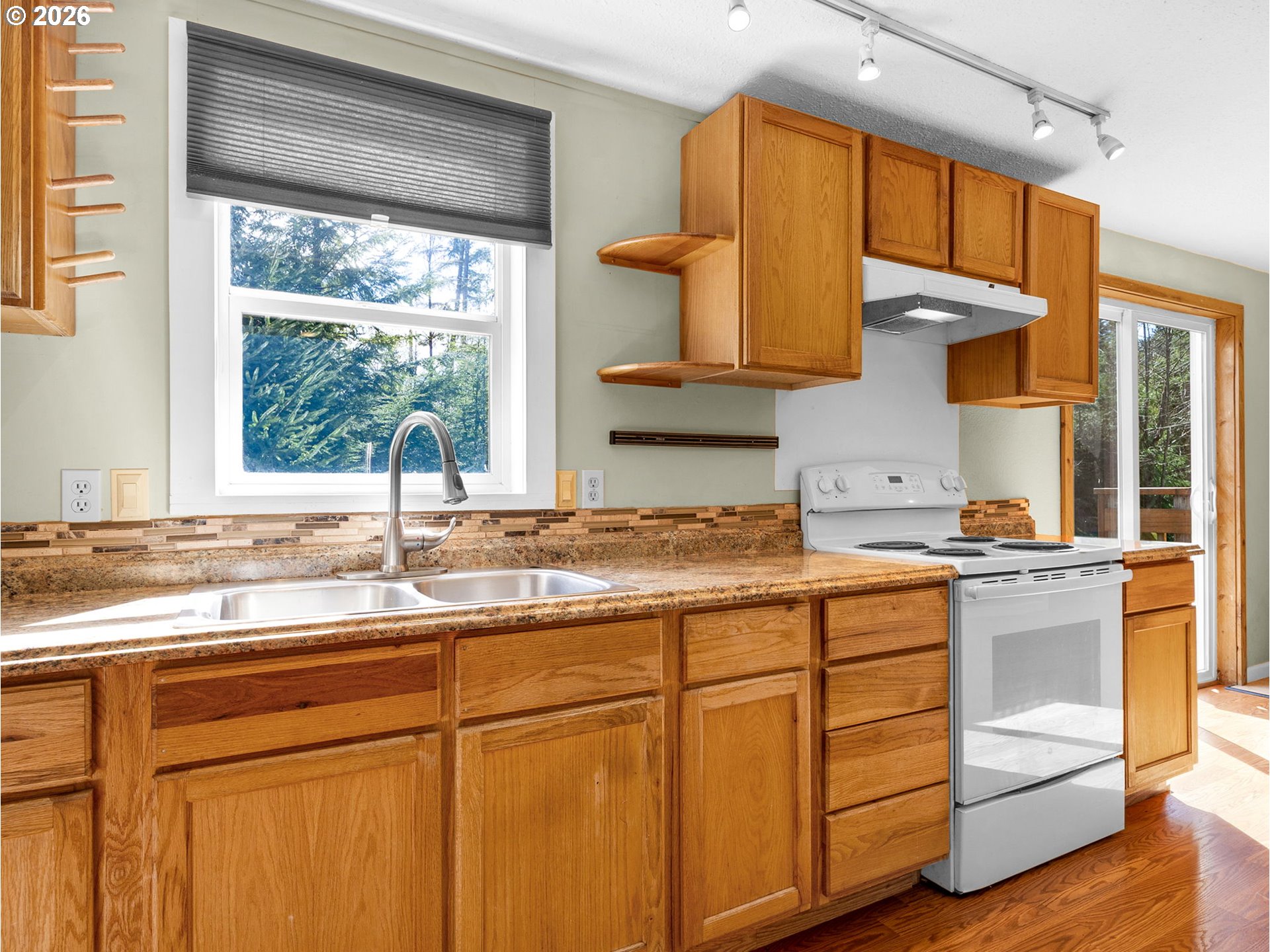 44176 Highway 30 Astoria, OR 97103 - Photo 8 of 32 a kitchen with a sink cabinets and window