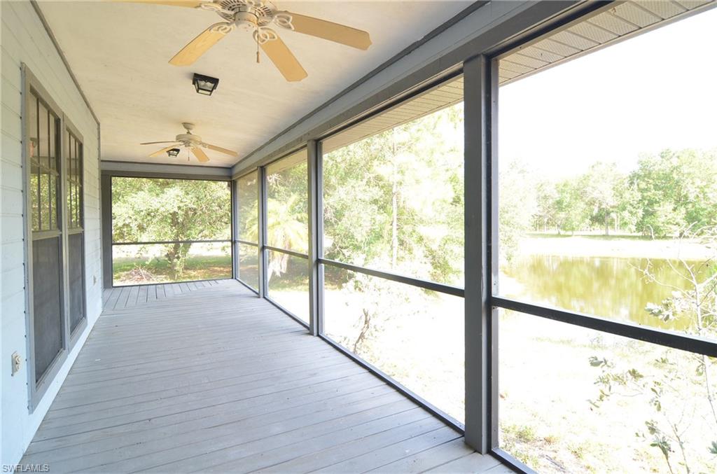 17550 Capper Lane Estero, FL 33928 - Photo 8 of 22 Front porch over looking the lake