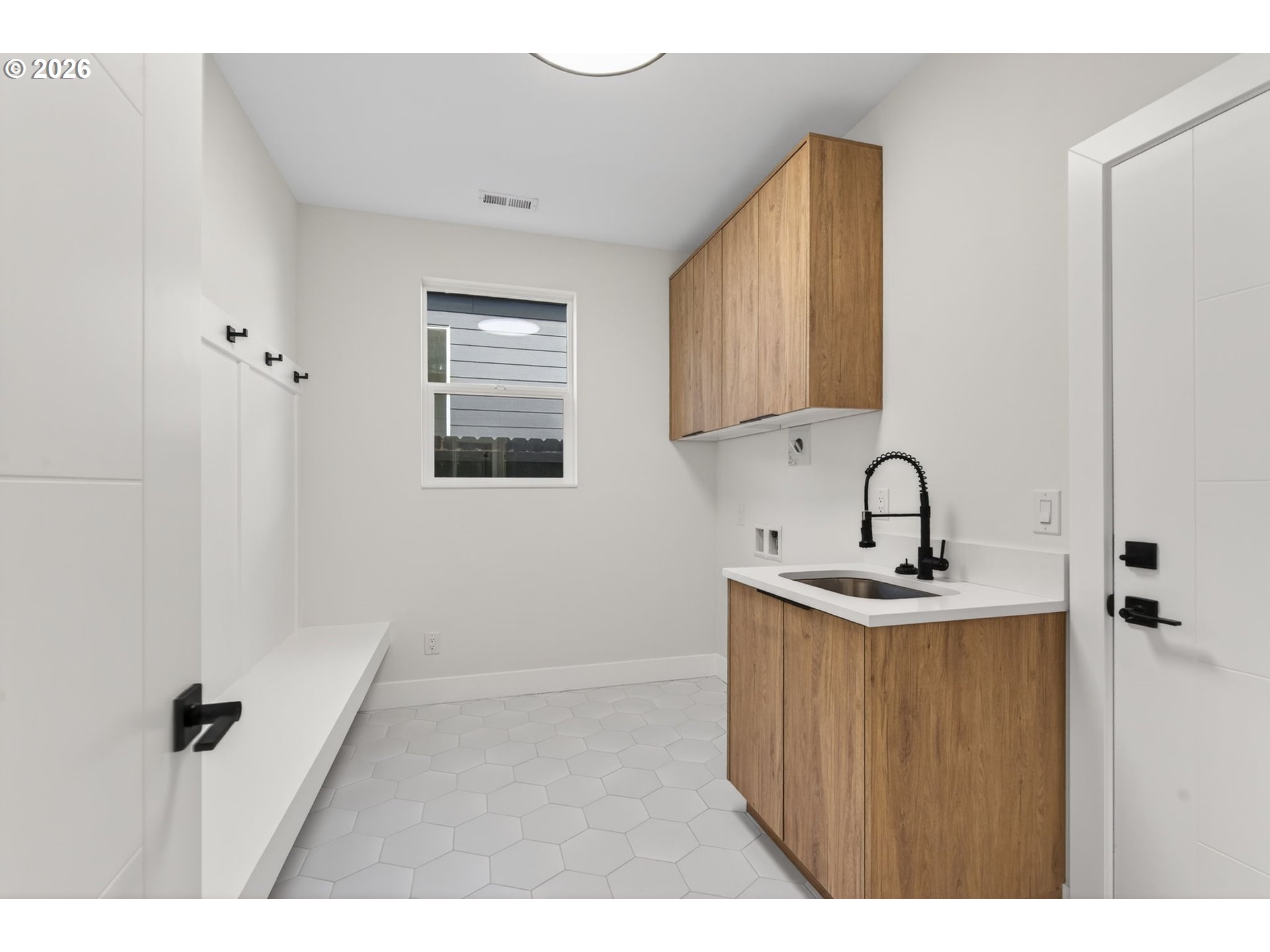 734 Southeast 35th Street Battle Ground, WA 98604 - Photo 12 of 42 a kitchen with a sink and cabinets