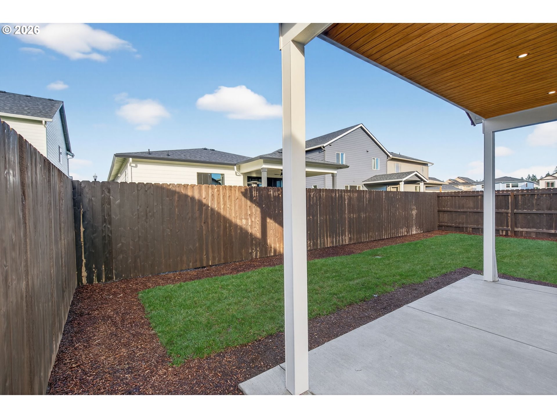 734 Southeast 35th Street Battle Ground, WA 98604 - Photo 37 of 42 a view of a backyard with wooden fence