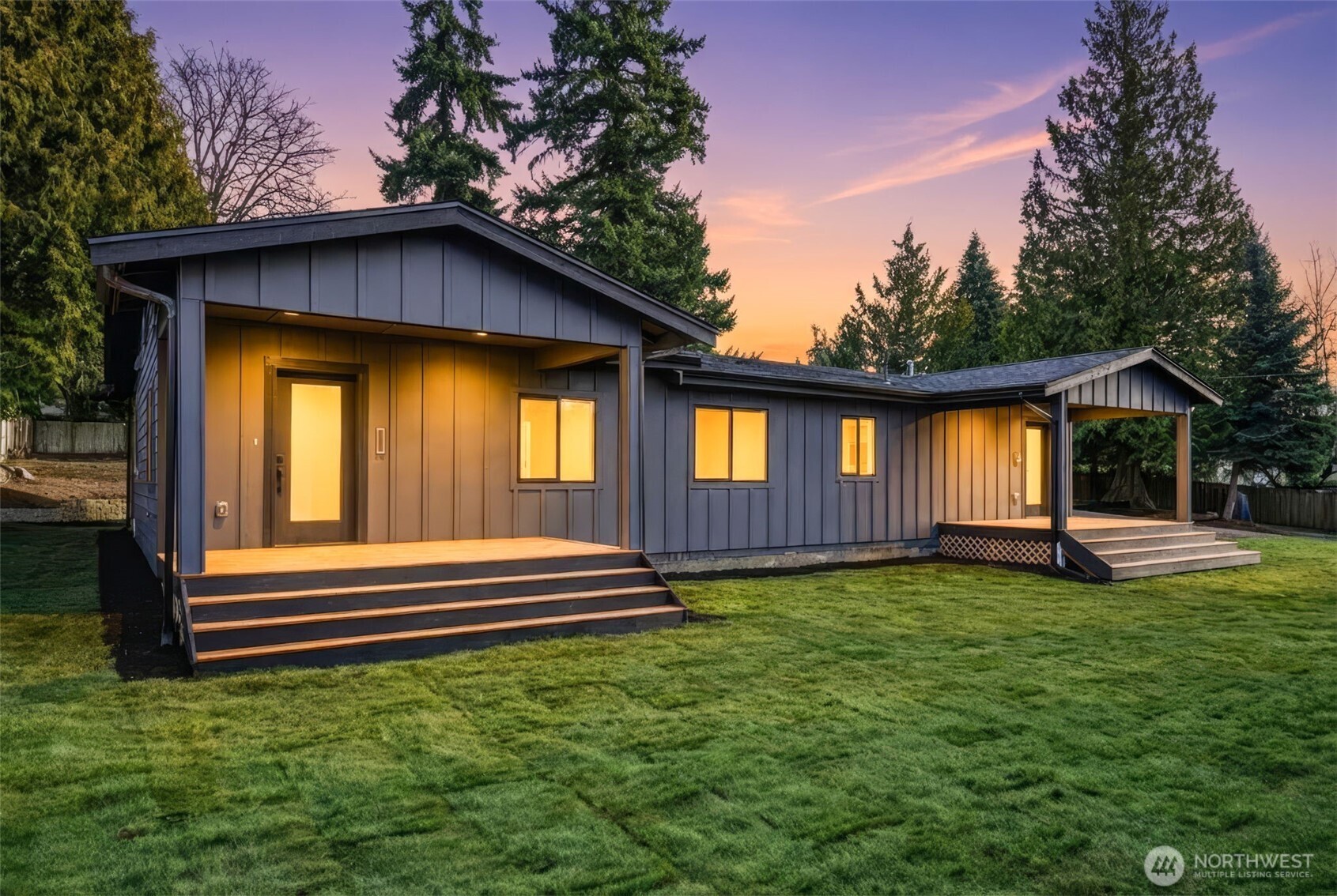 4922 Northeast 20th Place Renton, WA 98059 - Photo 1 of 38 a front view of a house with a yard