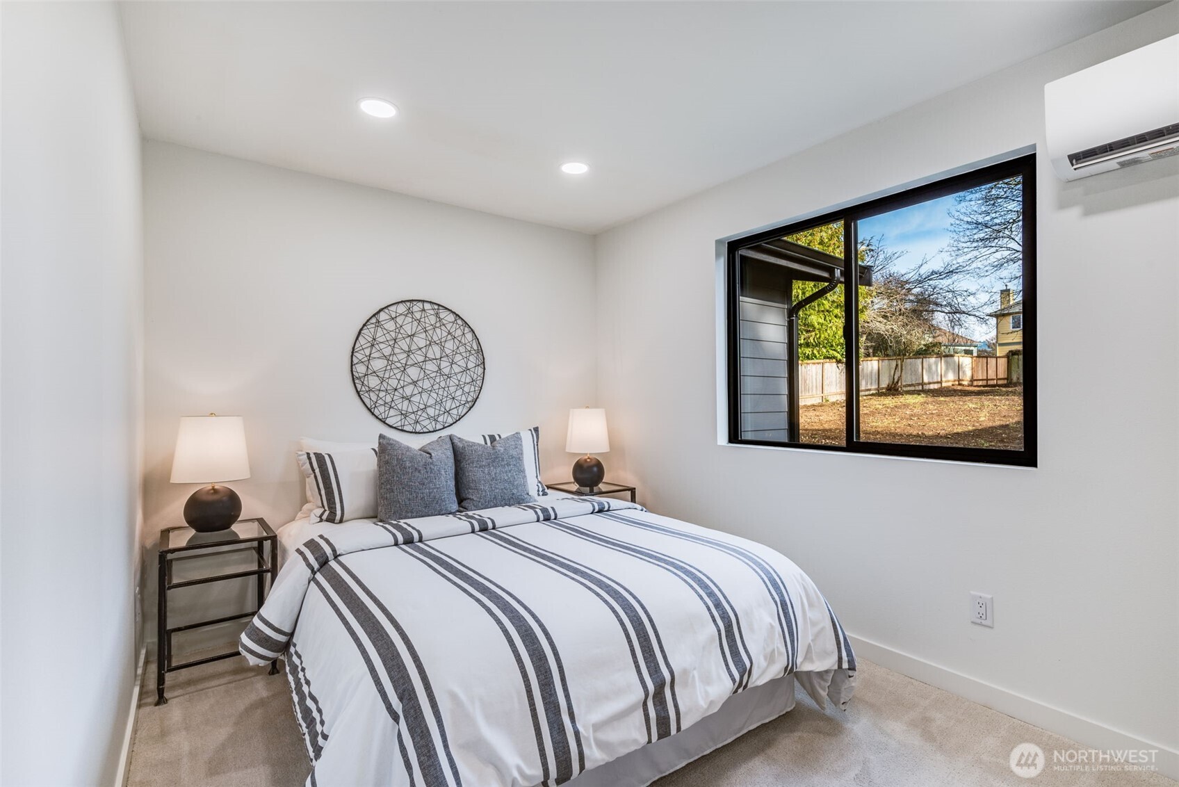 4922 Northeast 20th Place Renton, WA 98059 - Photo 12 of 38 a bedroom with a bed and a window