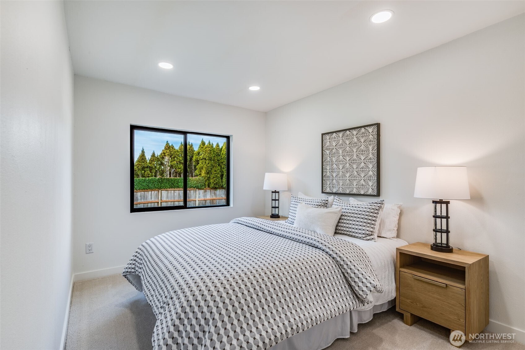 4922 Northeast 20th Place Renton, WA 98059 - Photo 15 of 38 a bedroom with a bed and a night stand