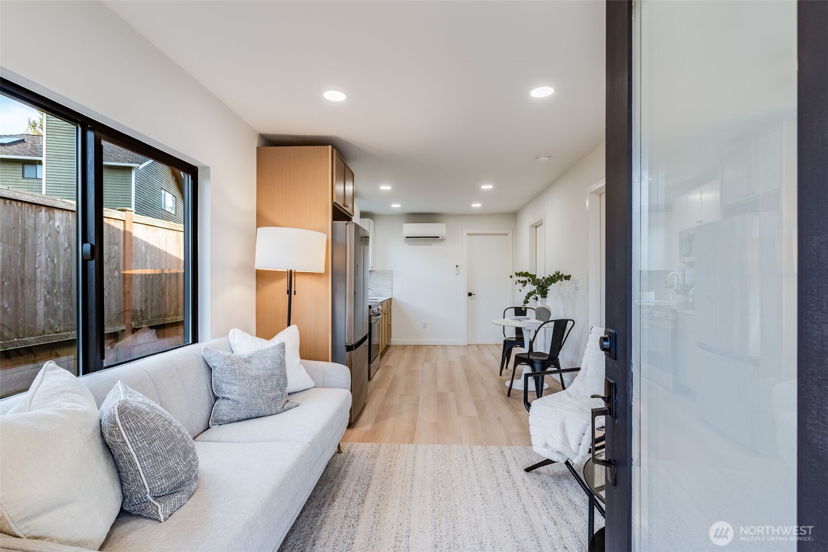 4922 Northeast 20th Place Renton, WA 98059 - Photo 16 of 38 a living room with furniture wooden floor and a large window