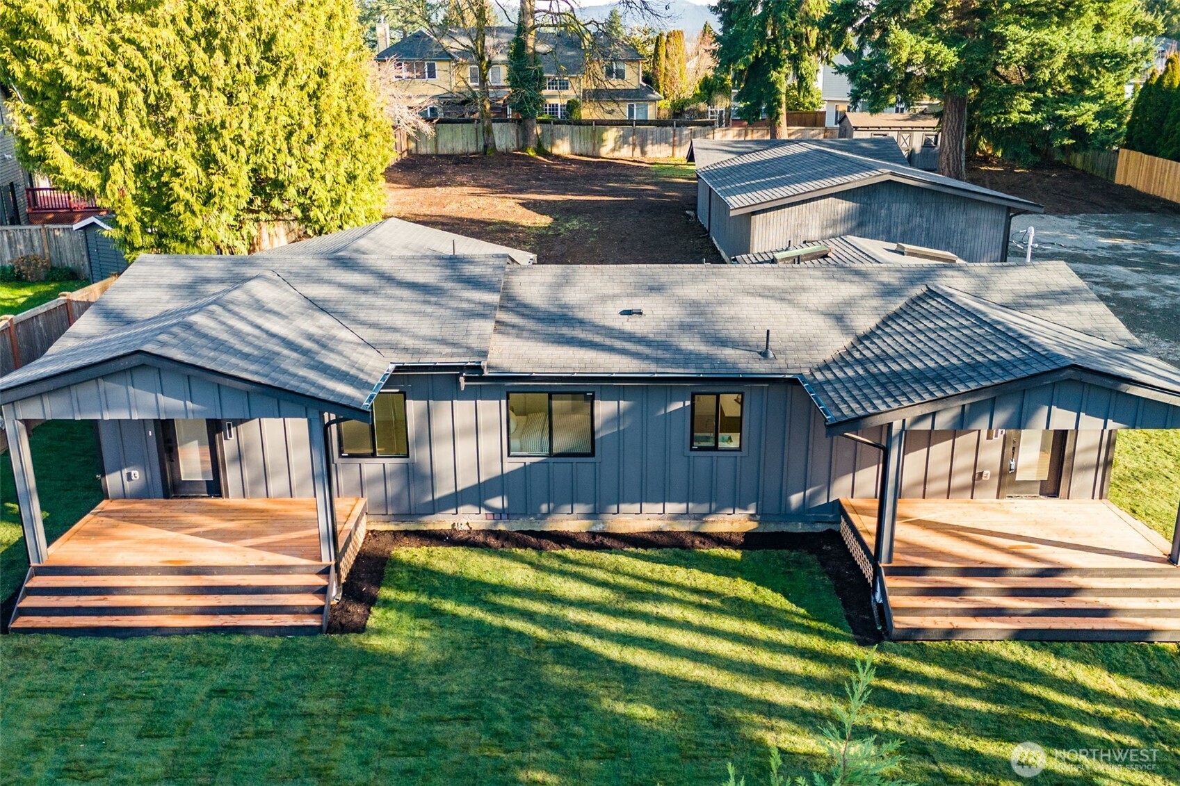 4922 Northeast 20th Place Renton, WA 98059 - Photo 2 of 38 a front view of a house with a yard table and chairs