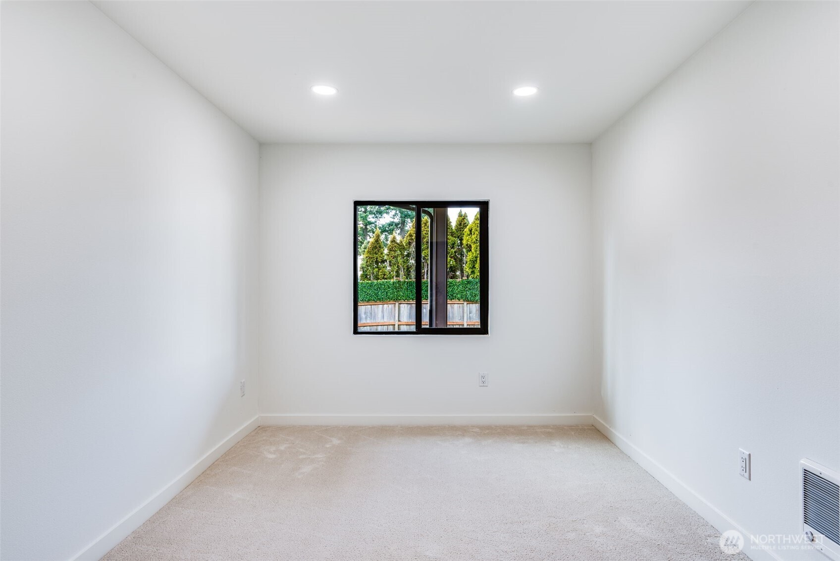 4922 Northeast 20th Place Renton, WA 98059 - Photo 21 of 38 an empty room with a window