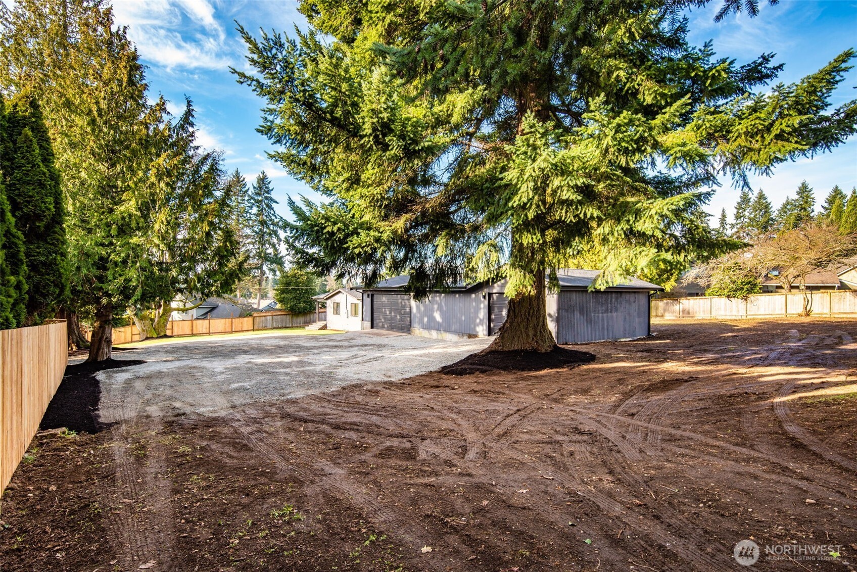 4922 Northeast 20th Place Renton, WA 98059 - Photo 27 of 38 a view of a yard with plants and trees