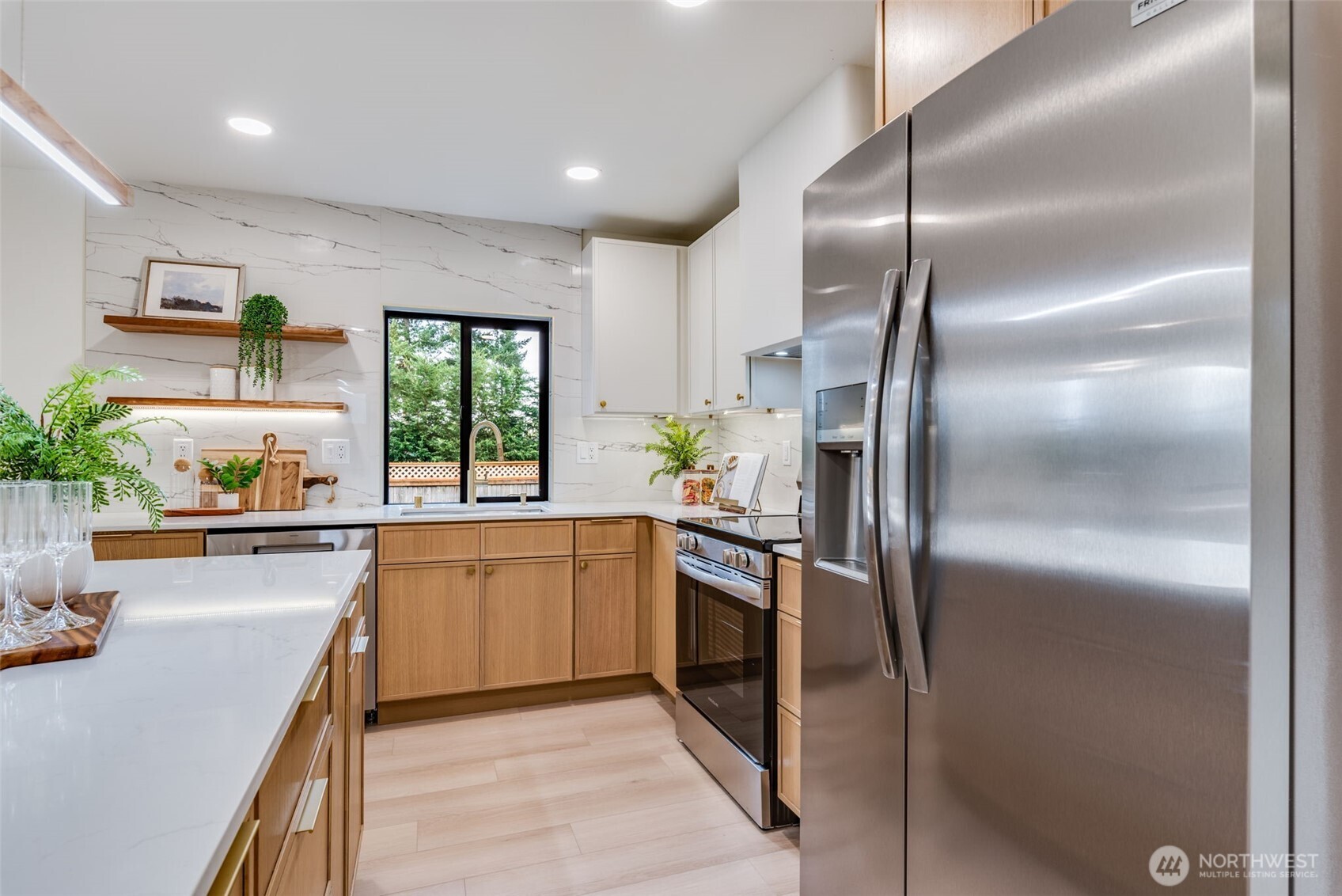 4922 Northeast 20th Place Renton, WA 98059 - Photo 5 of 38 a kitchen with a refrigerator and a sink