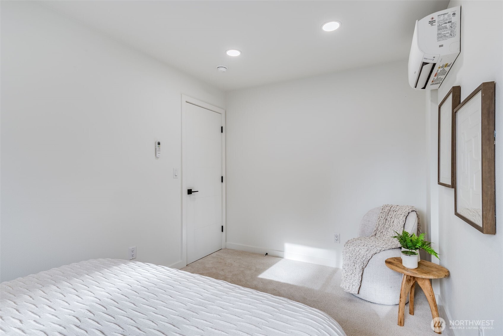 4922 Northeast 20th Place Renton, WA 98059 - Photo 8 of 38 a bedroom with a bed table and a potted plant