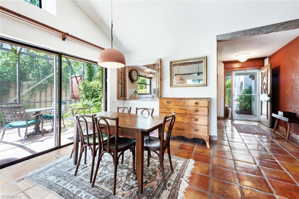 839 Reef Point Circle, Unit 41 Naples, FL 34108 - Photo 12 of 37 a dining room with furniture and wooden floor