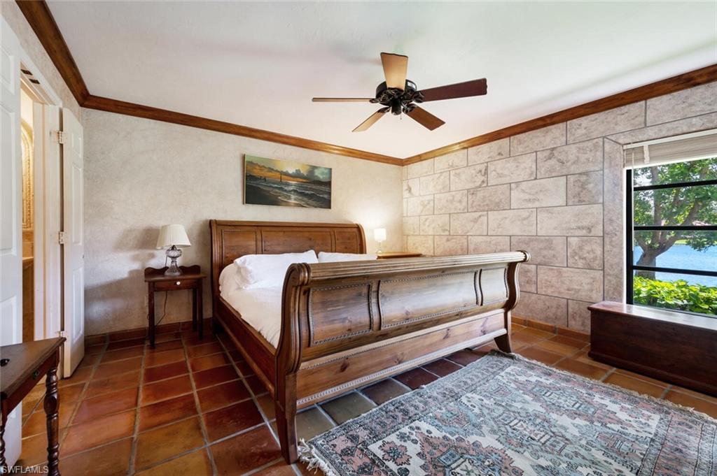 839 Reef Point Circle, Unit 41 Naples, FL 34108 - Photo 18 of 37 a bedroom with a bed and a window