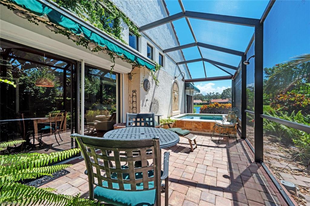 839 Reef Point Circle, Unit 41 Naples, FL 34108 - Photo 2 of 37 a patio with patio outdoor seating and yard