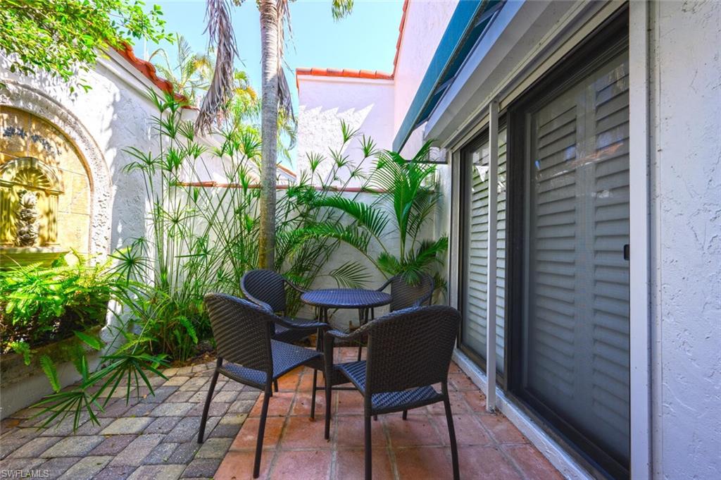 839 Reef Point Circle, Unit 41 Naples, FL 34108 - Photo 23 of 37 a view of an outdoor seating area